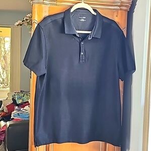 Mens black pole shirt by Calvin Klein. XL. Great golf‎ shirt with short sleeves.